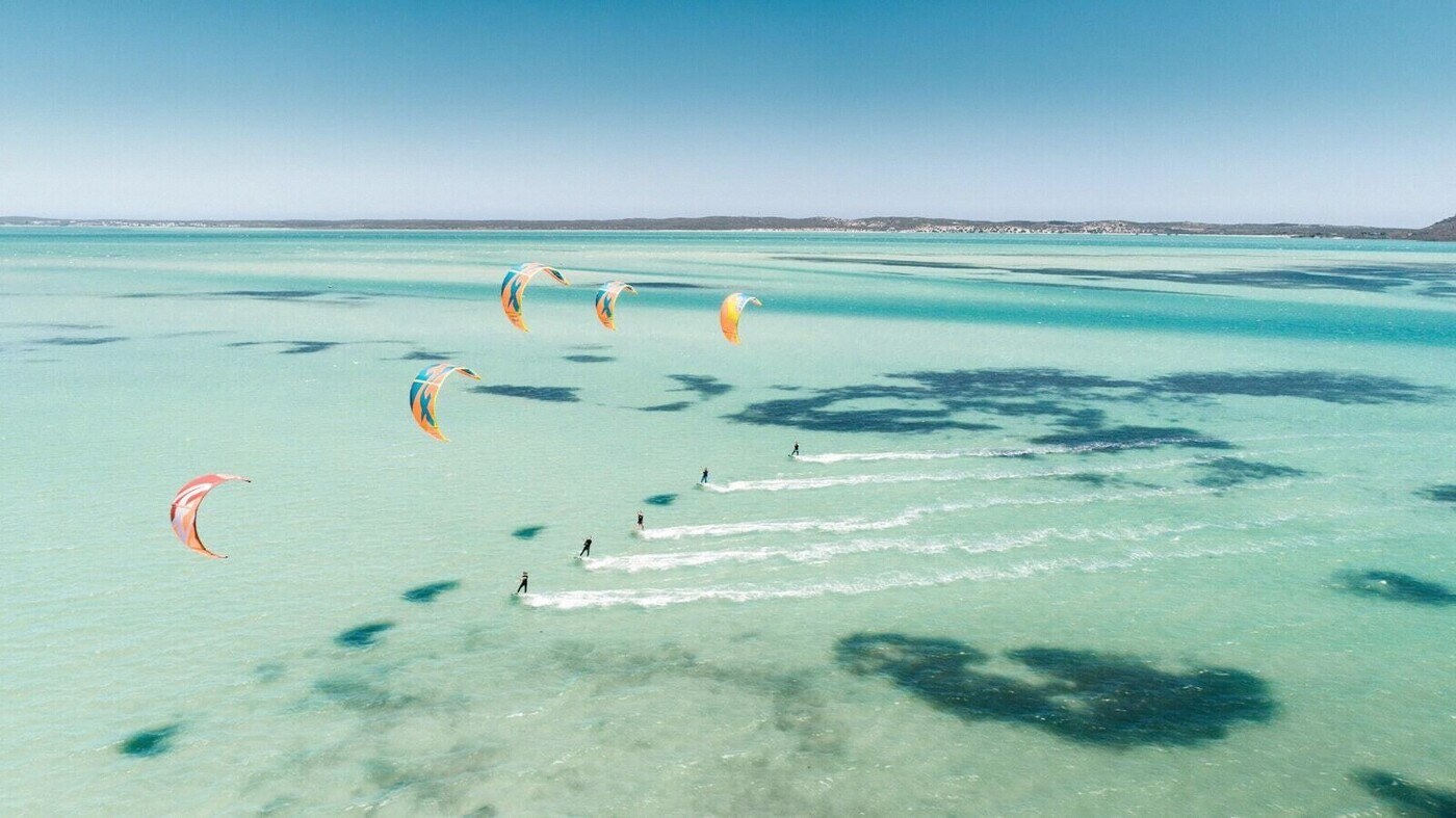 Kitesurfers on the turquoise water off Le Morne